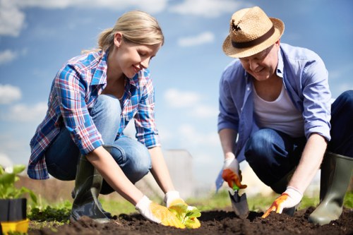 Landscape gardening in Palmers Green featuring pathways, shrubs, and seating